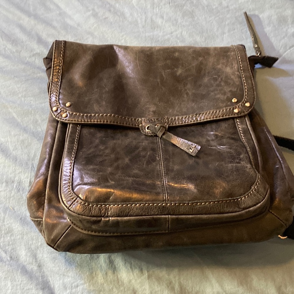 The Sak black leather messenger bag.